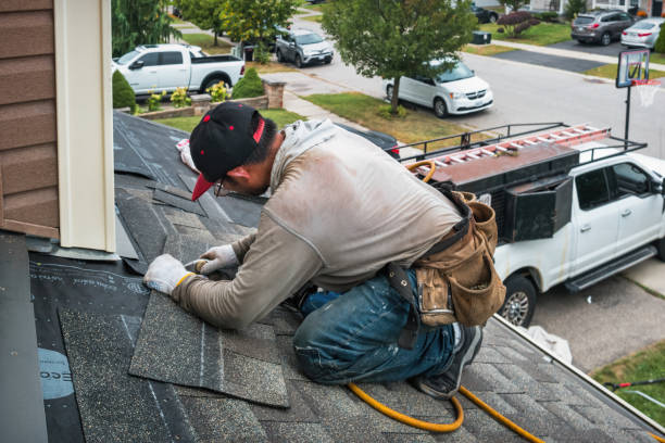 Professional Roofing technician working in Rayland, OH